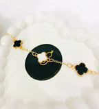Golden Four-Leaf Clover Bracelet – Reversible Black & White Mother-of-Pearl Style Lucky Charm Jewelry